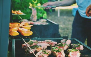 person grilling meat