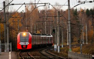 orange train on railroad during daytime